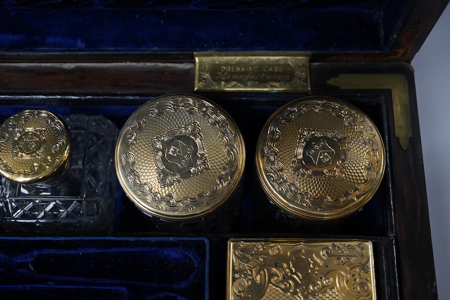 A Victorian brass mounted coromandel travelling toilet box(incomplete), with seven silver gilt lidded glass jars, four hallmarked for Thomas Johnson I, London, 1853 with one lacking glass base and one associated jar with